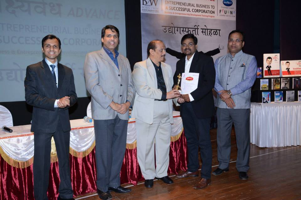 Pranjal Chawan receiving an award with fellow honorees
