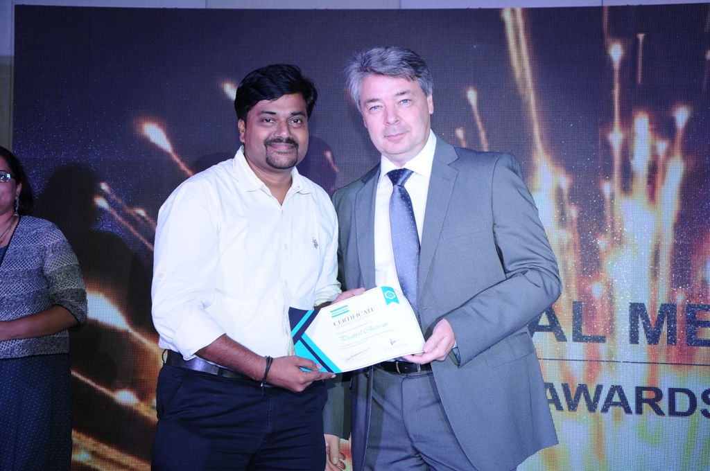 Pranjal Chawan receiving a certificate on stage